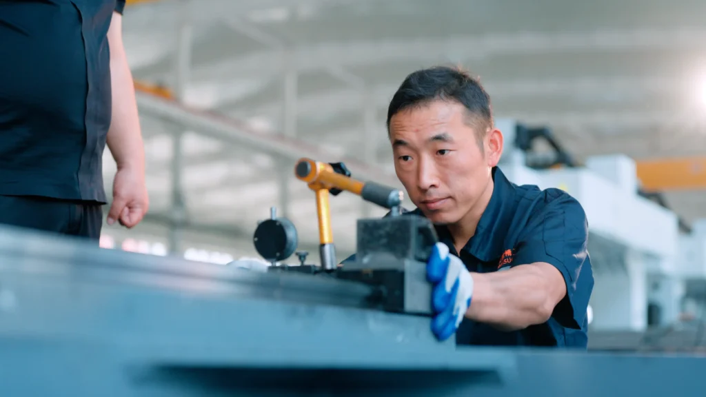 CNC gantry mill precision and specifications: Factory technician inspecting machine accuracy